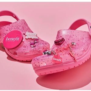 Croc x Benefit collaboration, clear pink crocs with benefit exclusive giblets.